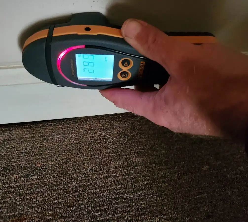 Moisture detection at baseboard during Storm Damage Restoration in Little Elm
